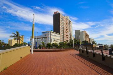 Fototapeta na wymiar Residential building behind the paved promenade of Durban's 