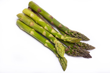 Delicious bunch of raw ripe green asparagus new harvest isolated on white background