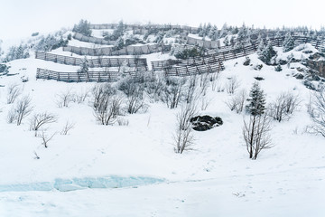 View of snow covered moutain with avalanchy protection barrier