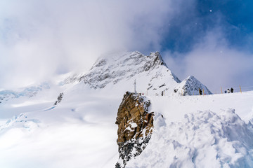 Fototapeta na wymiar View of snowy jungfraujoch in snow day from the Jungfrau Railway in Switzerland