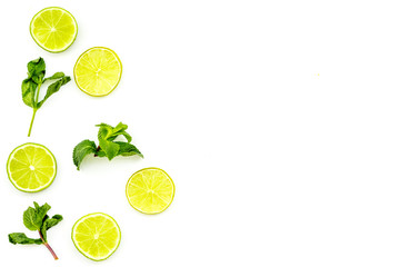 Citrus frame. Lime round slices composition on white background top view copy space