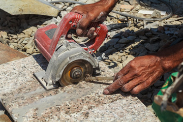 Workers are using stone cutting tools.