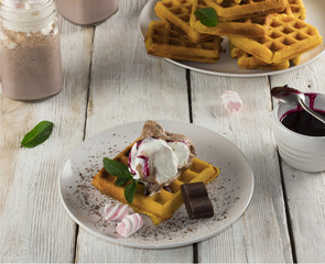 waffles with ice cream, milkshake, chocolate and fruit jam