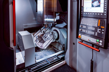 Metalworking CNC milling machine. Cutting metal modern processing technology. © Andrei Armiagov