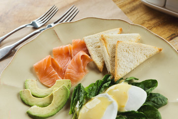 Healthy breakfast with poached eggs and smoked salm
