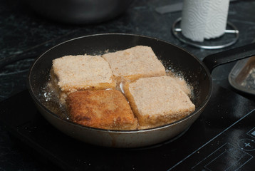 Frying Square Bread for Sandwich. Food Preparing pane in Pan with Oil. Food Ingredients. Restaurant.