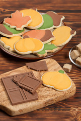 Autumn Style. Homebaked Decorated Sugar Cookies With Royal Icing. Olive Tree Wooden Board. Chocolate.