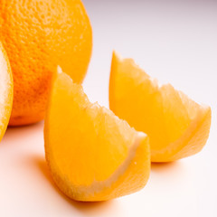 oranges and juice on a white background