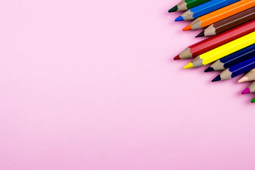 Pencils set on roe tone color paper. Empty space for text and design. Minimalism concept