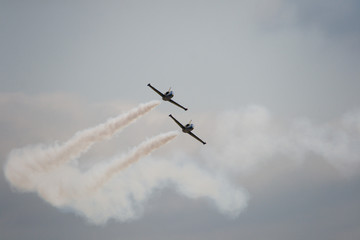 Military aircraft showing a group of aerobatics in the sky