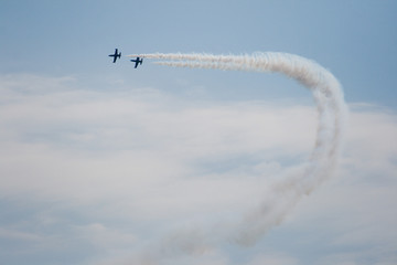 Military aircraft showing a group of aerobatics in the sky