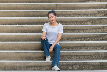 Obraz premium Portrait of beautiful asian woman,Hipsters girl for take a picture outdoor,Thailand people stand on stair