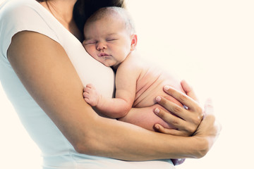 Sleeping baby on mothers chest