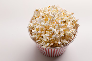 Bucket of popcorn on white background