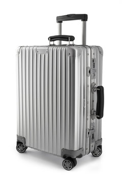 Suitcase or traveling luggage bag isolated on white background