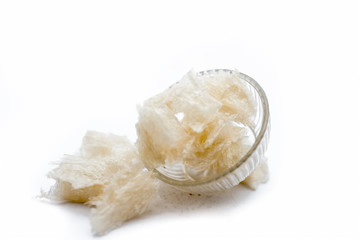 Popular Indian and Asian sweet milk dessert China grass or halwa grass in a bowl isolated on white.