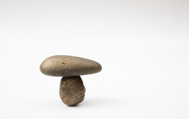 Balance different stone concepts together on a white background.