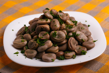 boiled broad beans on a rustic background