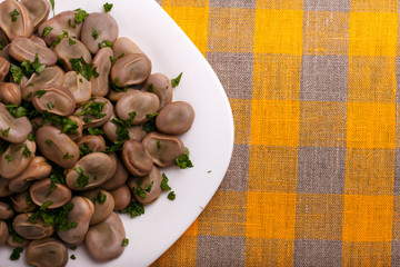 boiled broad beans on a rustic background