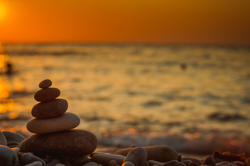 stack of zen stones on pebble beach