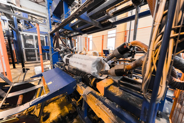 Fiberglass production industry equipment at manufacture background