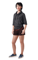 Fototapeta premium young woman posing in studio on white background, wearing brown shorts and shirt