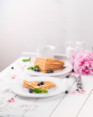crepes and blueberries, country style, summer living, light wooden table