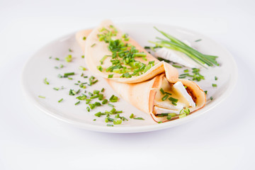 Pancake with brie cheese and chives
