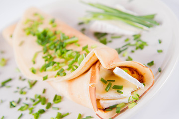 Pancake with brie cheese and chives