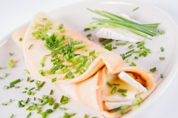 Pancake with brie cheese and chives