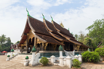 View of the Buddhist Wat Xieng Thong temple ("Temple of the Golden City") in Luang Prabang, Laos.
