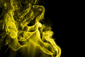 Yellow smoke on black background