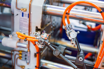 Fototapeta premium Fragment of the injection molding machine.