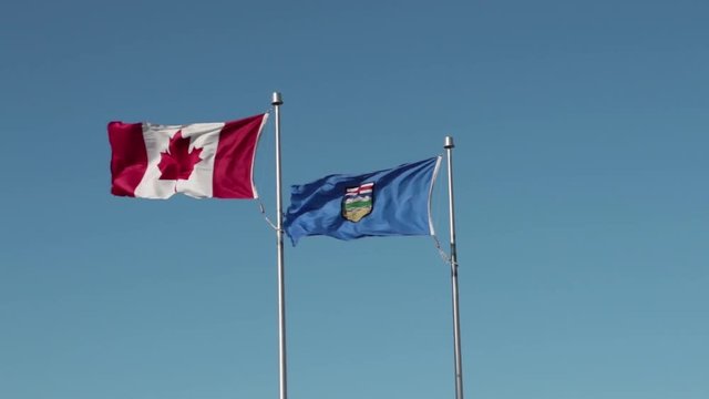 Canada National Flag and Alberta Provincial Flag side by side 