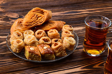 Turkish sweet baklava on plate with Turkish tea.