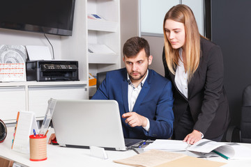 Fototapeta premium Administrator and seller at workplace in showroom