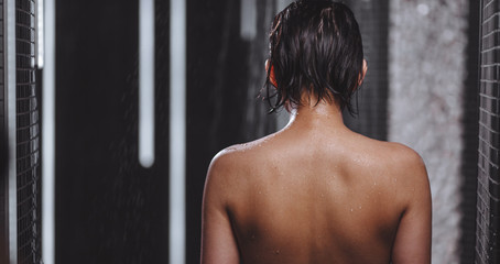 wet back of woman in the morning. close-up back view shot