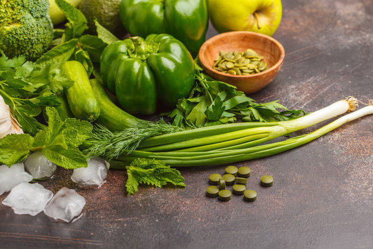 Green vegetables on a dark background. Vegetable vegan diet food background. Healthy lifestyle concept.