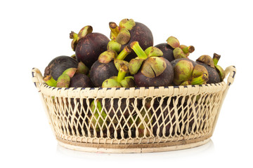magosteen in basket isolated on white background