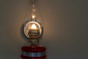 Old oil lamp on the wall