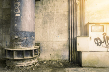 big drain iron. rust. decay. wall dirty. street dirty