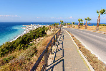 Coastal promenade and road with view of beautiful Rhodes bay. Greece