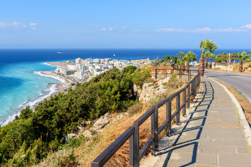 Fototapeta na wymiar Coastal promenade with view of Rhodes town. Greece