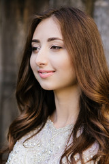 bride in wedding dress, beautiful brunette woman in national park near medieval castle,  portret,