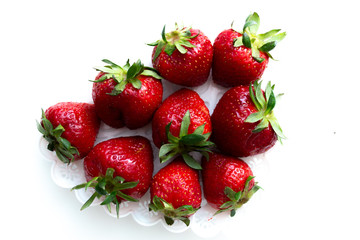 Strawberry scattered on a white background isolate