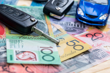'Purchasing or rental' conception with toy car and australian dollars