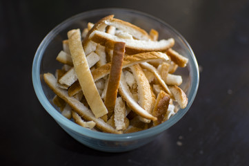 Bread crumbs in glass bowl with low light