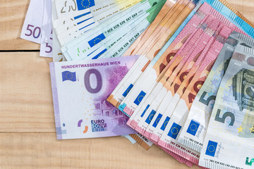 Zero euro souvenir with colorful euro banknotes
