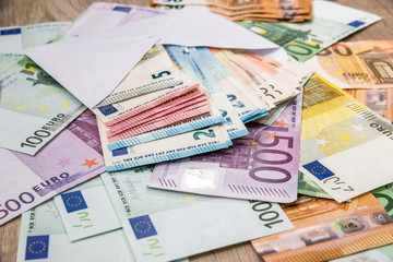 euro in white envelope on euro banknotes