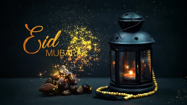 Eid Mubarak Greeting Gold Glitter Particles. Ramadan Candle Lantern with Wooden Prayer Beads and Dates